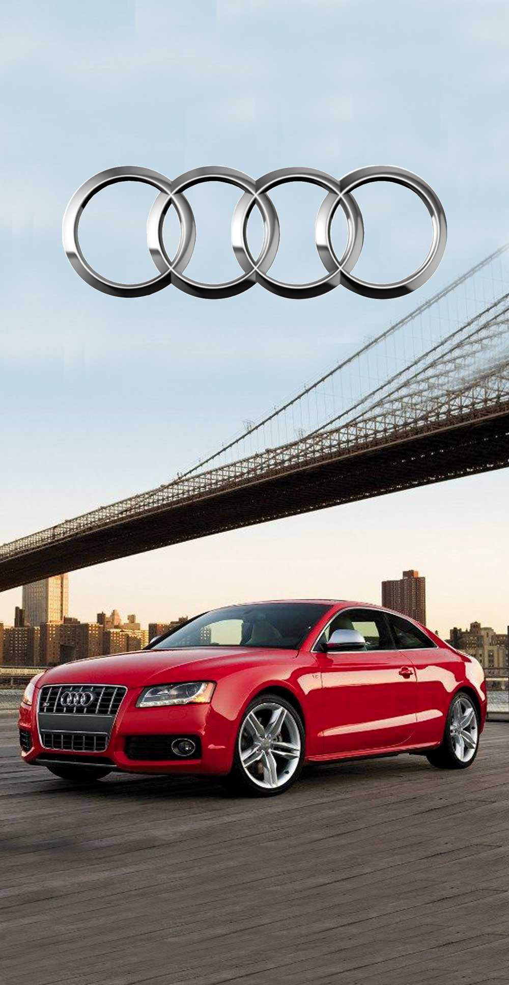 Червен Audi S5 с блестящи джанти на фона на мост и градски пейзаж, символизиращ стил и мощ.